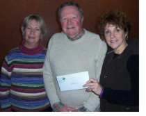Jim and Cheryl Comer present a grant to Audrey Curlan Marcy, Chair of the Pancreatic Cancer Alliance